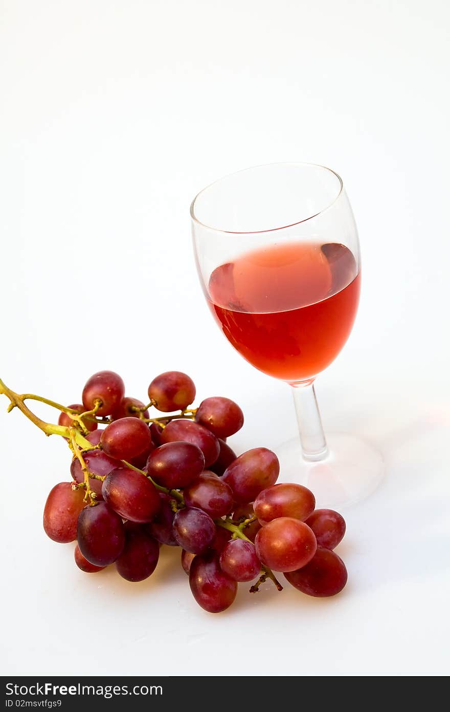 Wineglass with grapes