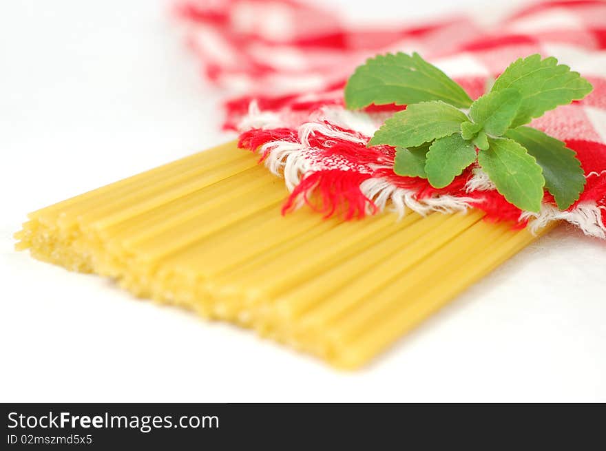 Spaghetti pasta and green stevia herb