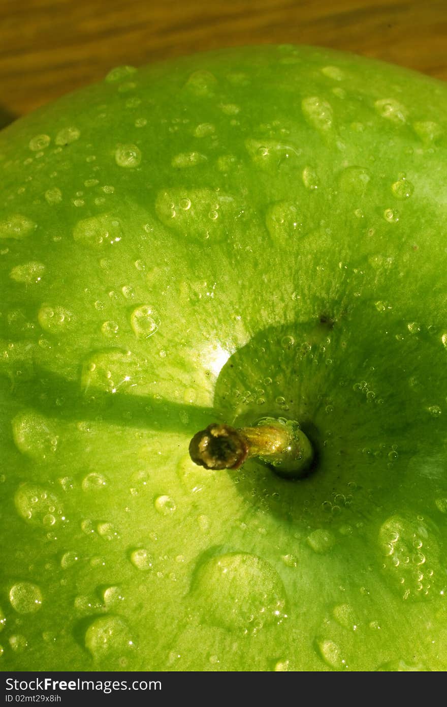 Detail of fresh English green apple covered in dew. Detail of fresh English green apple covered in dew