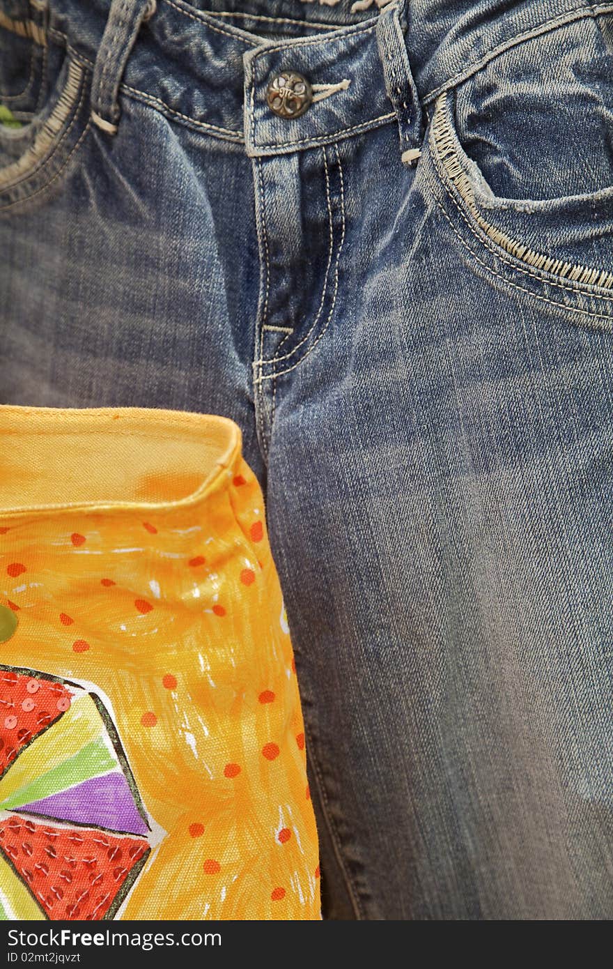 Pair of Blue Jeans With Part of Shopping Bag