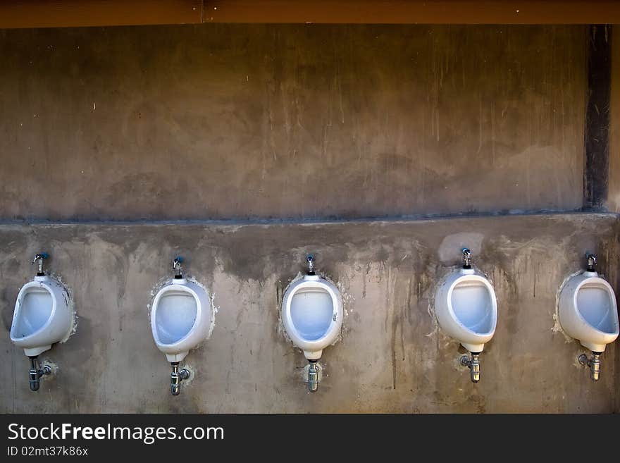 Five men toilet at the outdoor of hotel