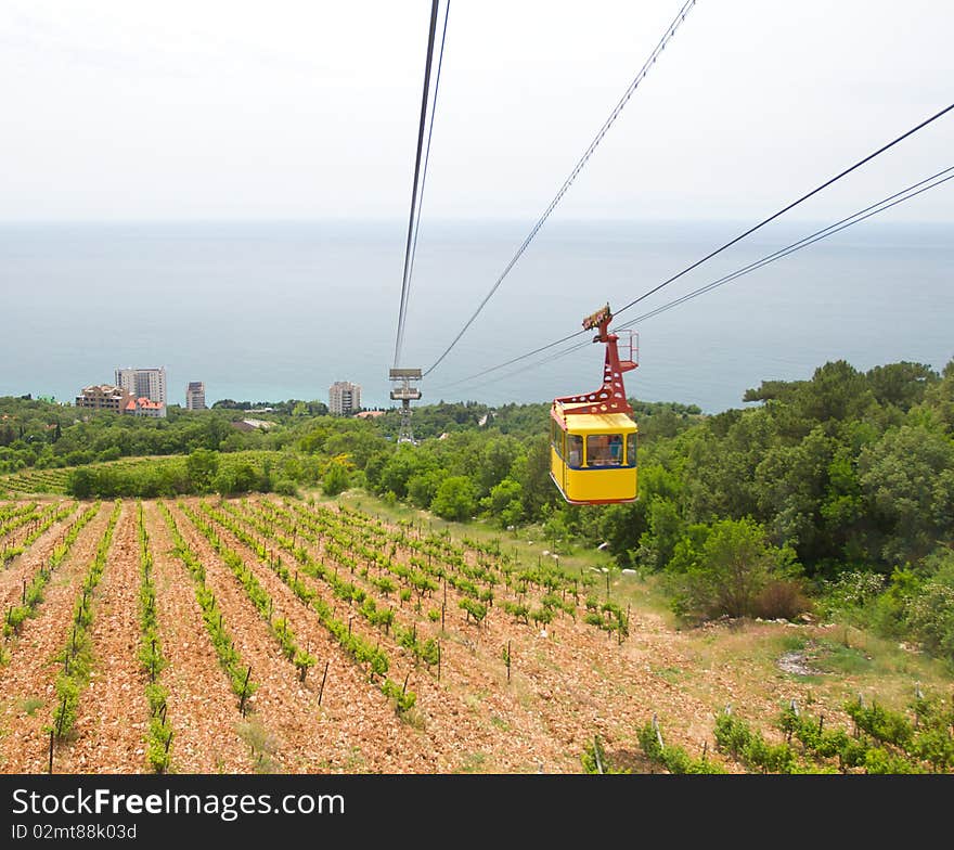 Rope-way with tram from mountain to sea