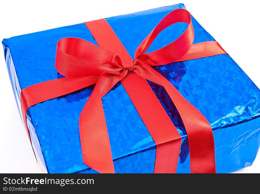 Gift box with red bow on white