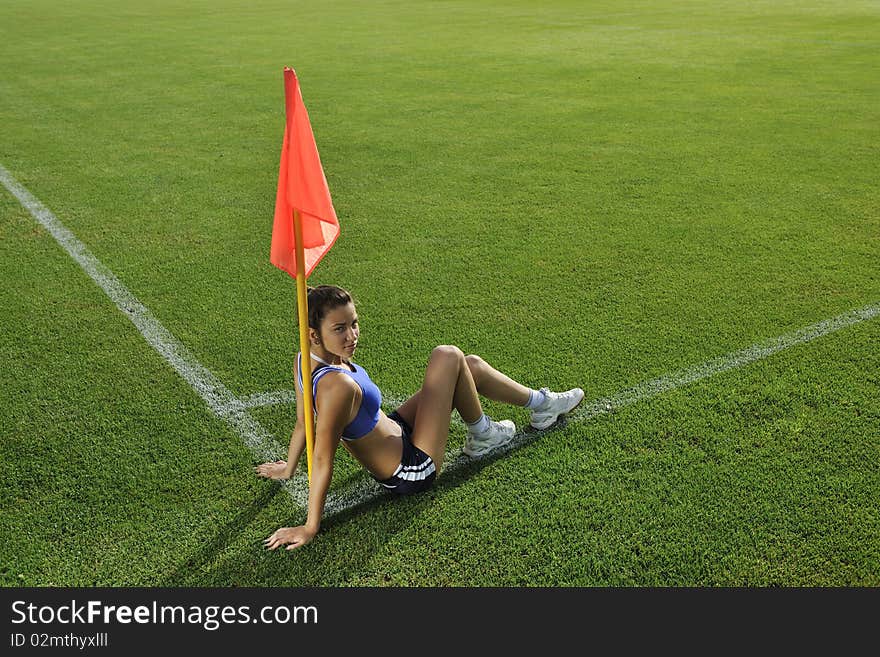 Young woman on corner of soccer stadium