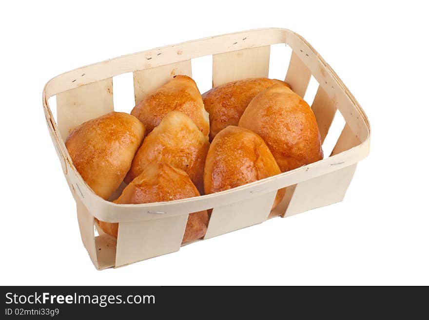 Pirogies pasties in basket, isolated on white