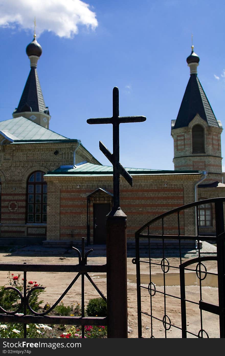 Iron cross on a gate at an input (entrance) in orthodox church. Iron cross on a gate at an input (entrance) in orthodox church