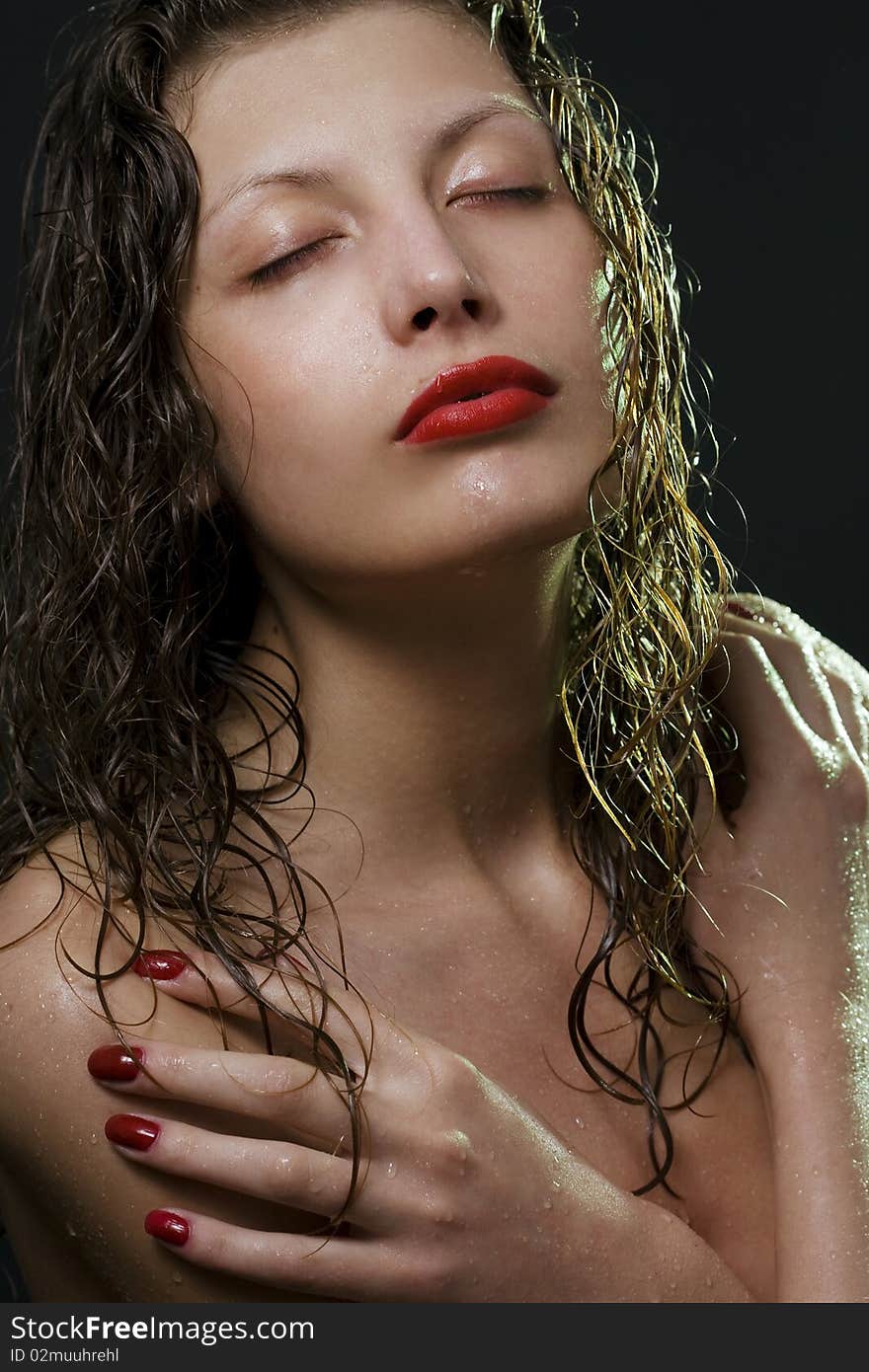 Portrait of the beautiful girl under shower over black. Portrait of the beautiful girl under shower over black