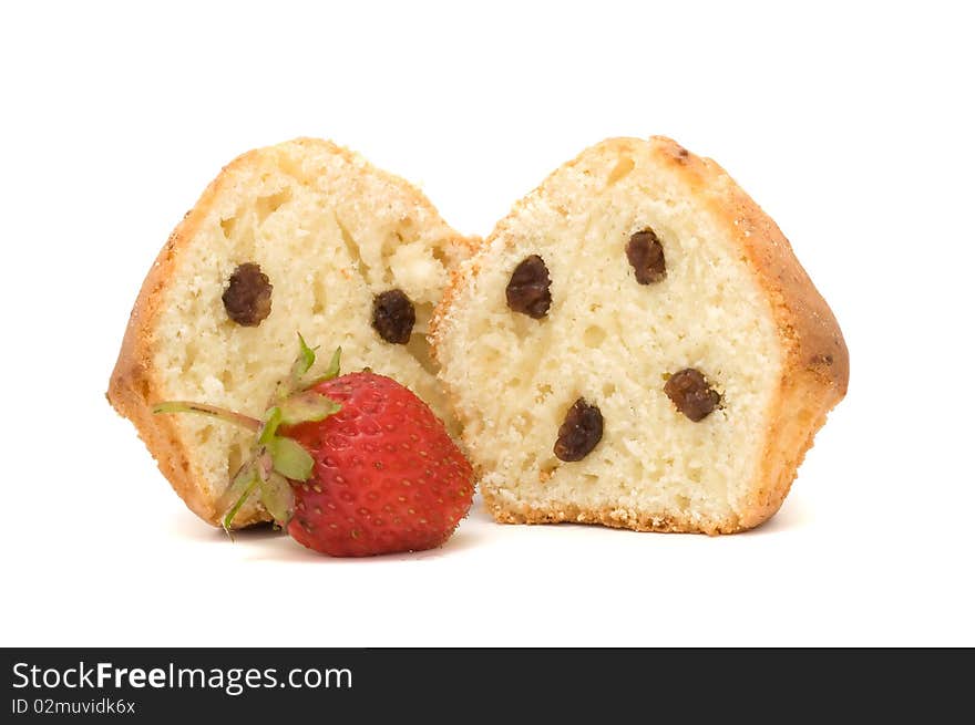 A fresh-baked muffin with raisins and strawberry isolated on a white background