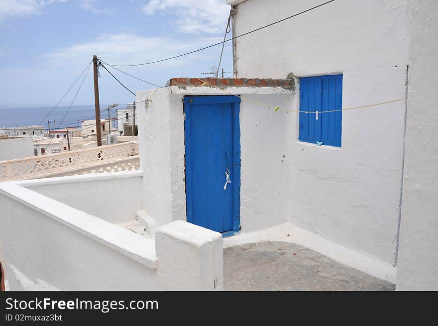 Simple and typical white and blue greek house