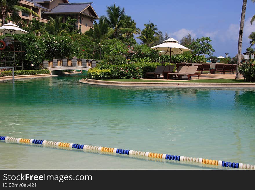 Beautiful swimming pool with bridge on it at the hotel