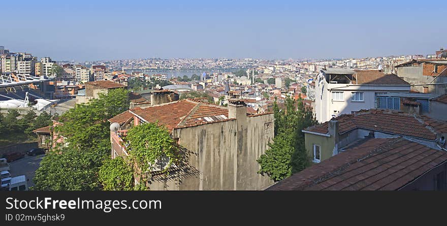 Panoramic view over an urban area of a large city with a river. Panoramic view over an urban area of a large city with a river