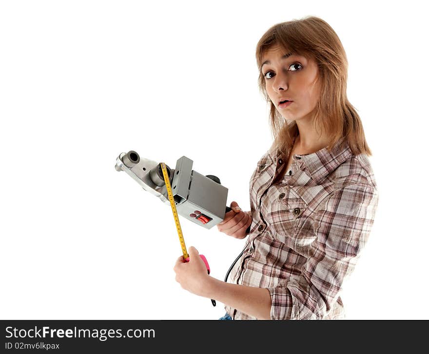 Portrait beautiful girl with tape measure and device for soldering the plastic pipes