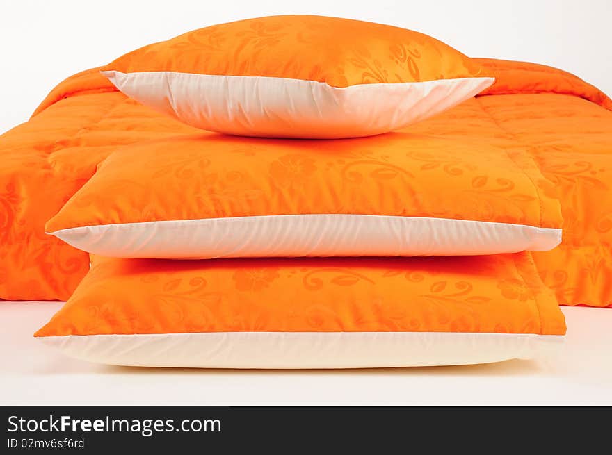 Orange bed spreads with soft pillows. Orange bed spreads with soft pillows.