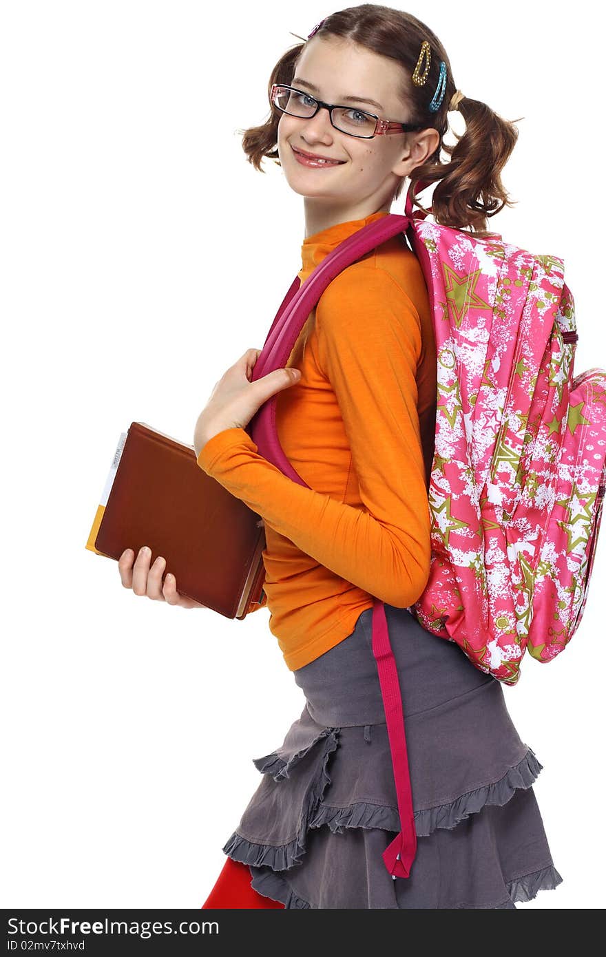 Portrait of schoolgirl with books and bag