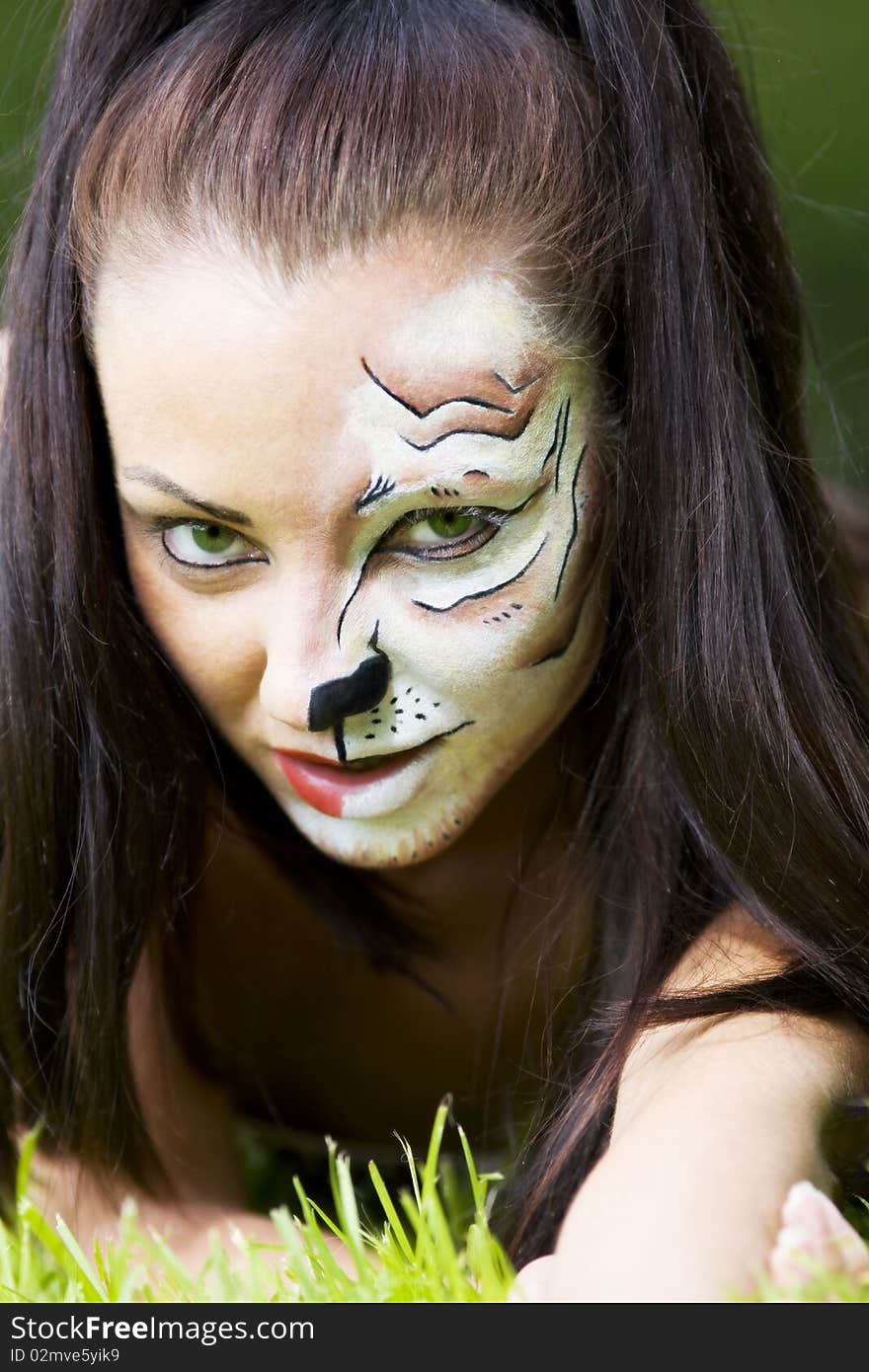 Woman with tigress face art portrait