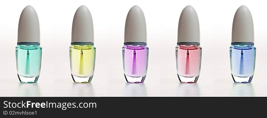 Small cosmetic bottles in diferent colors. Small cosmetic bottles in diferent colors