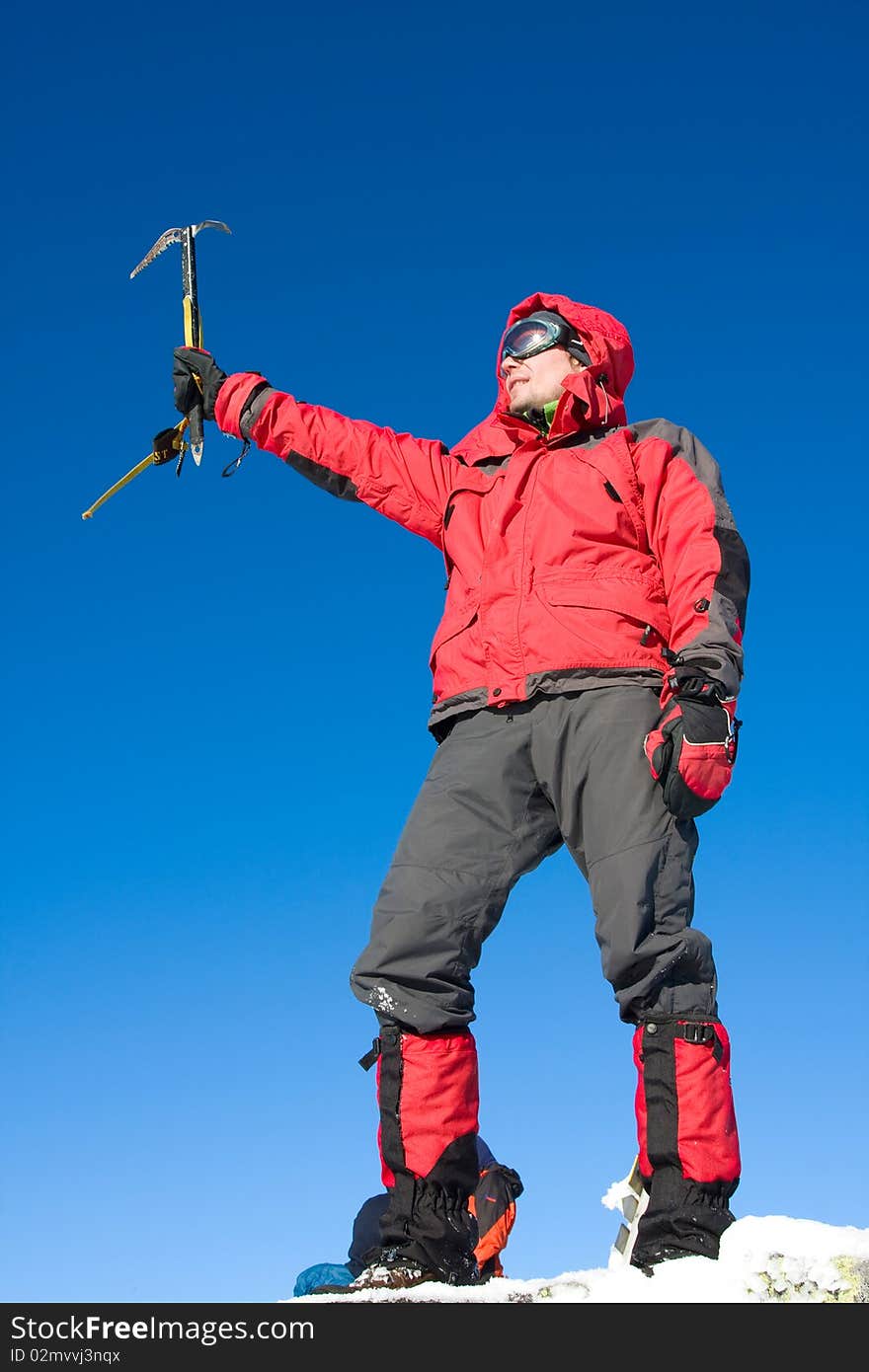 Hiker in winter in mountains