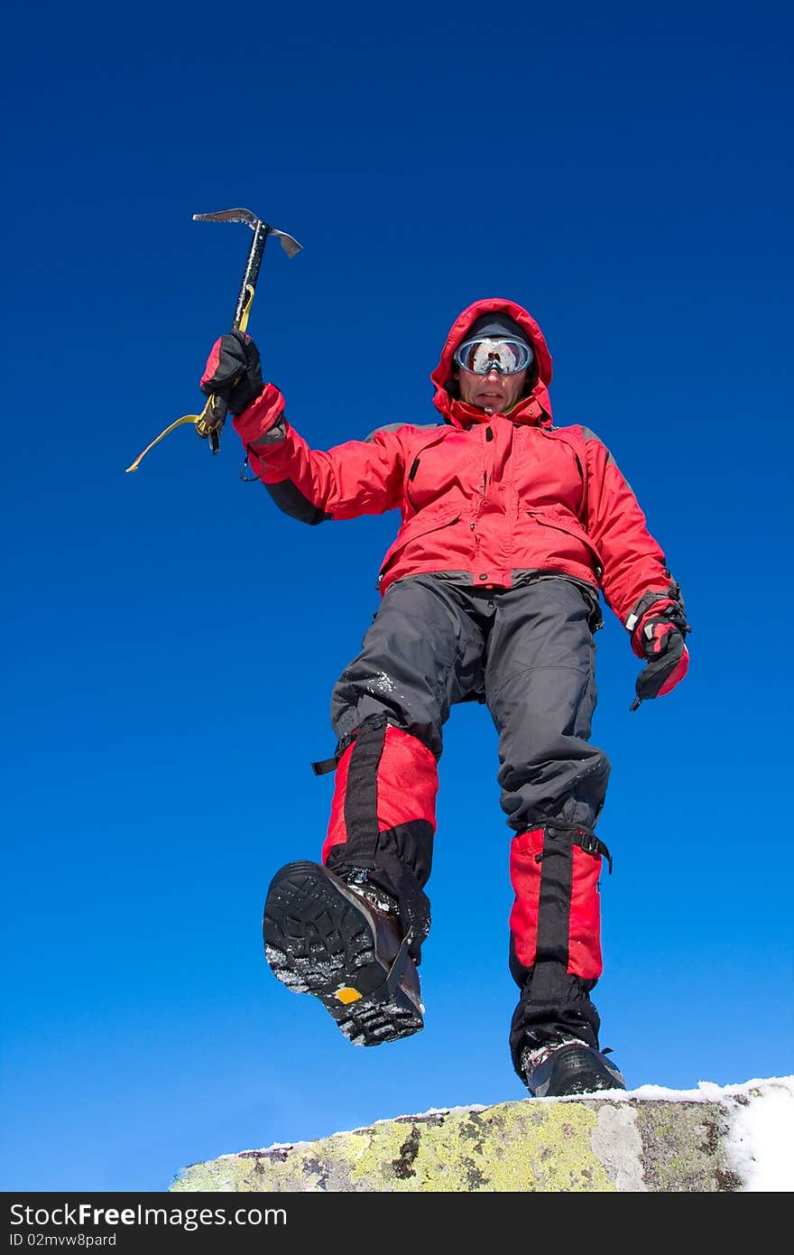 Hiker in winter in mountains