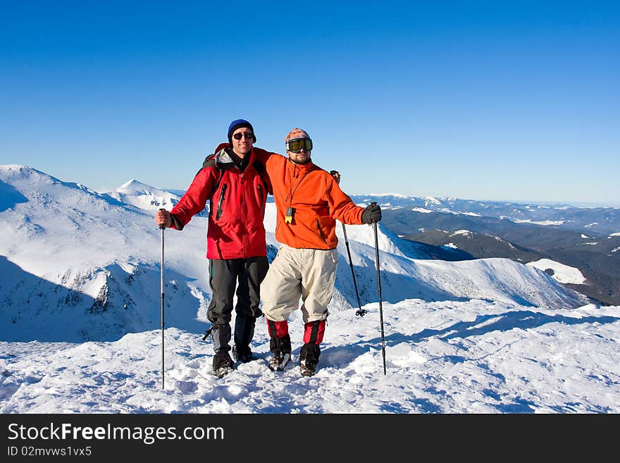 Hiker in winter in mountains