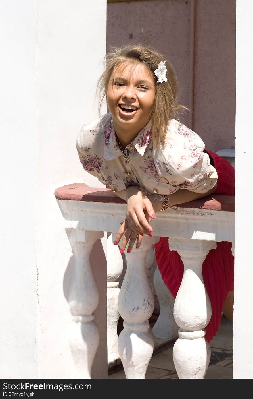 Girl standing on a veranda