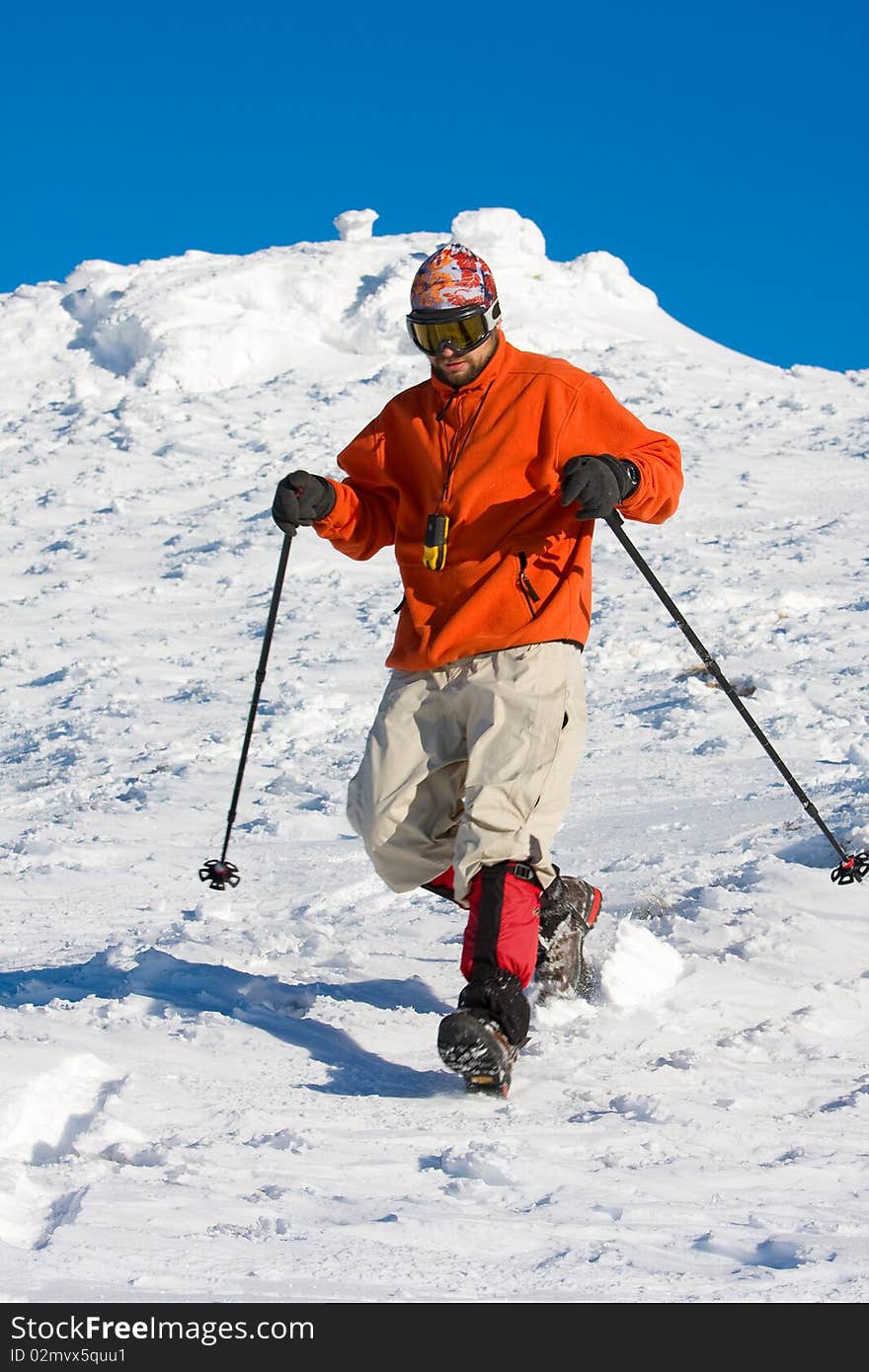 Hiker in winter in mountains