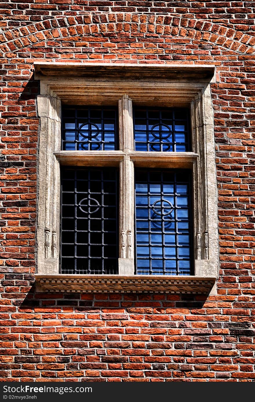 Window of a medieval building, very old brick wall