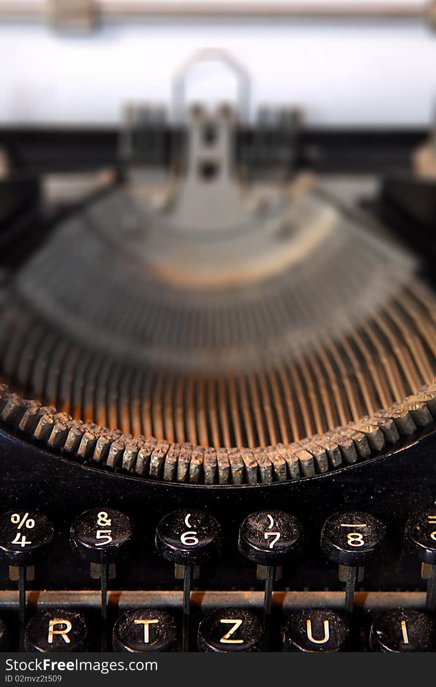 Close-up of an old typewriter with blank paper