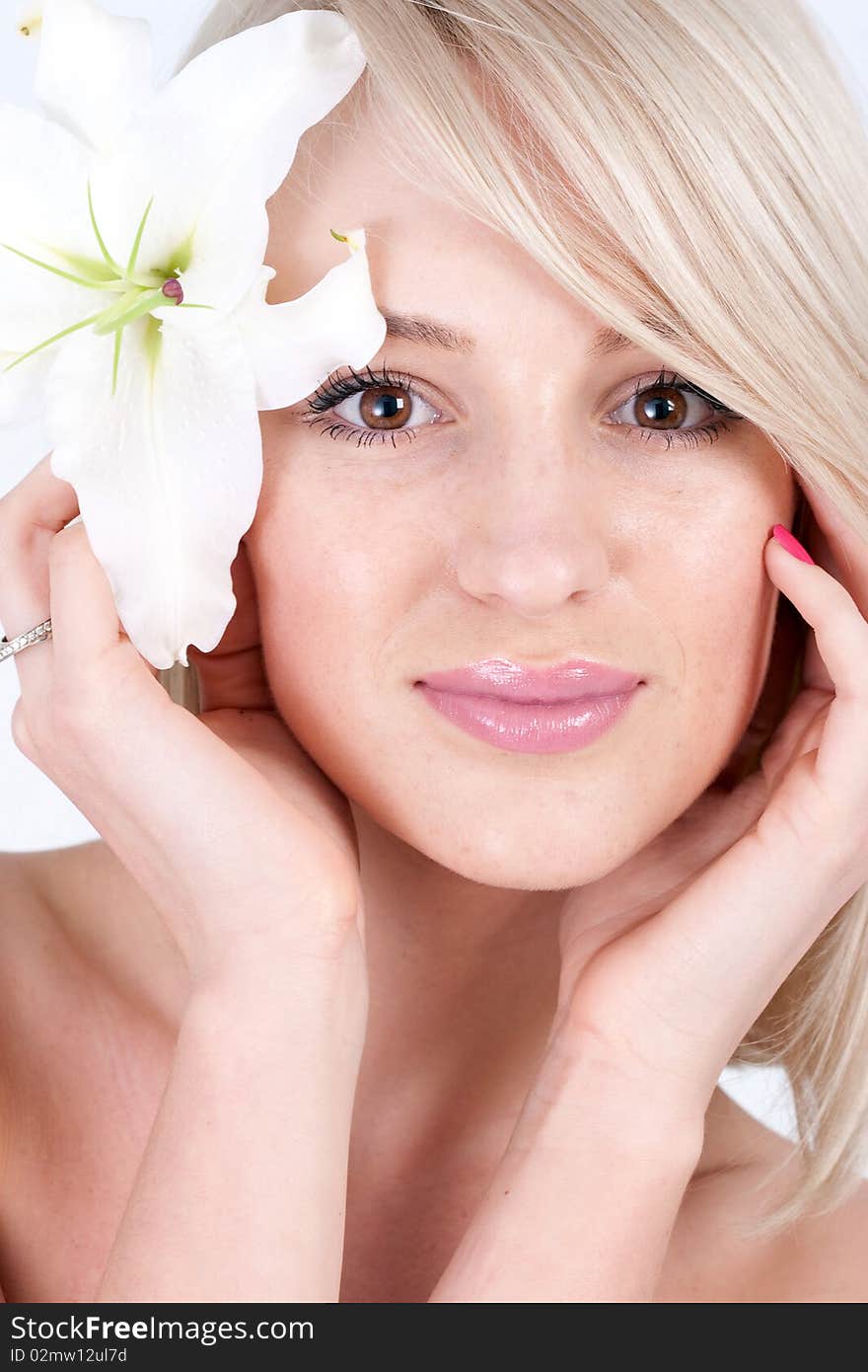 Beautiful blond woman with flower