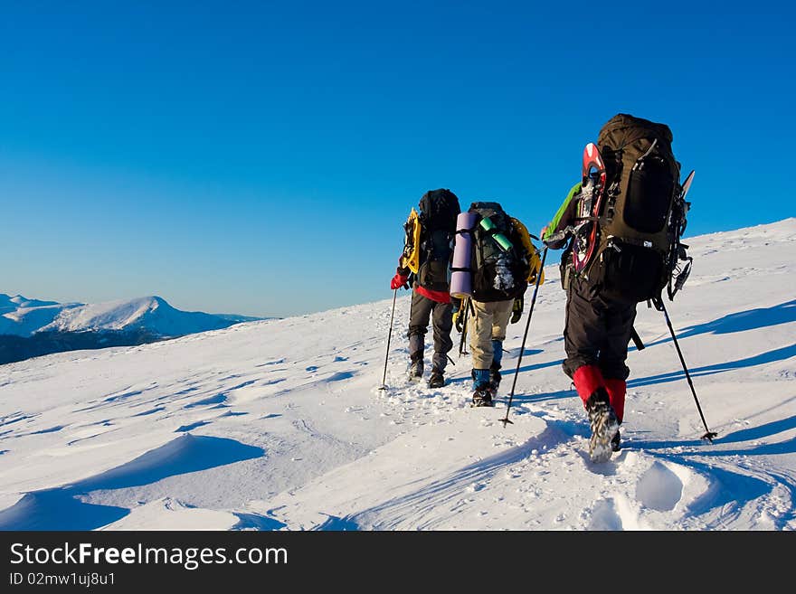 Hiker in winter in mountains