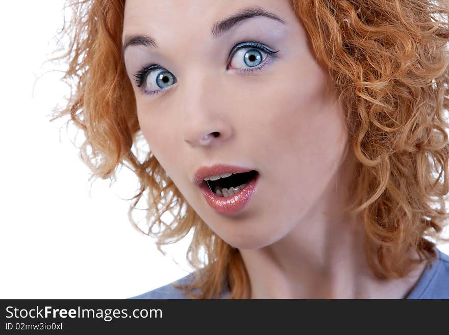 Surprised young woman with curly hair