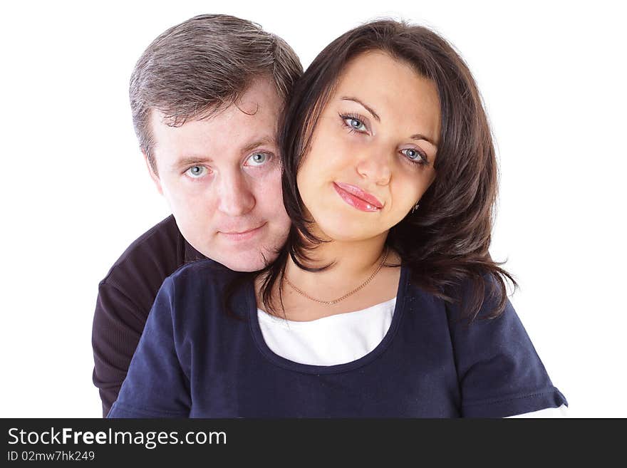 Mature couple smiling together over white