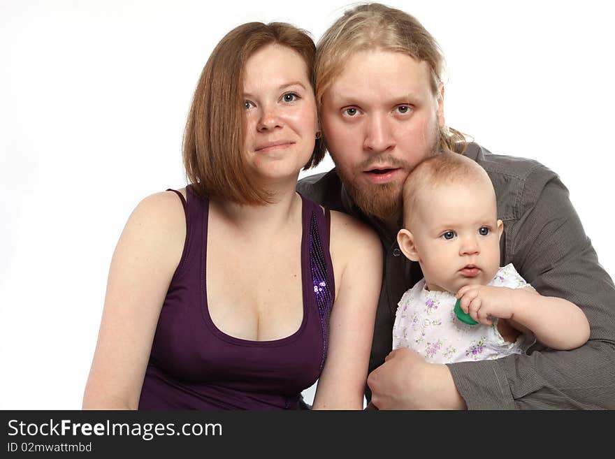 Beautiful young family: father, mother and baby isolated on white