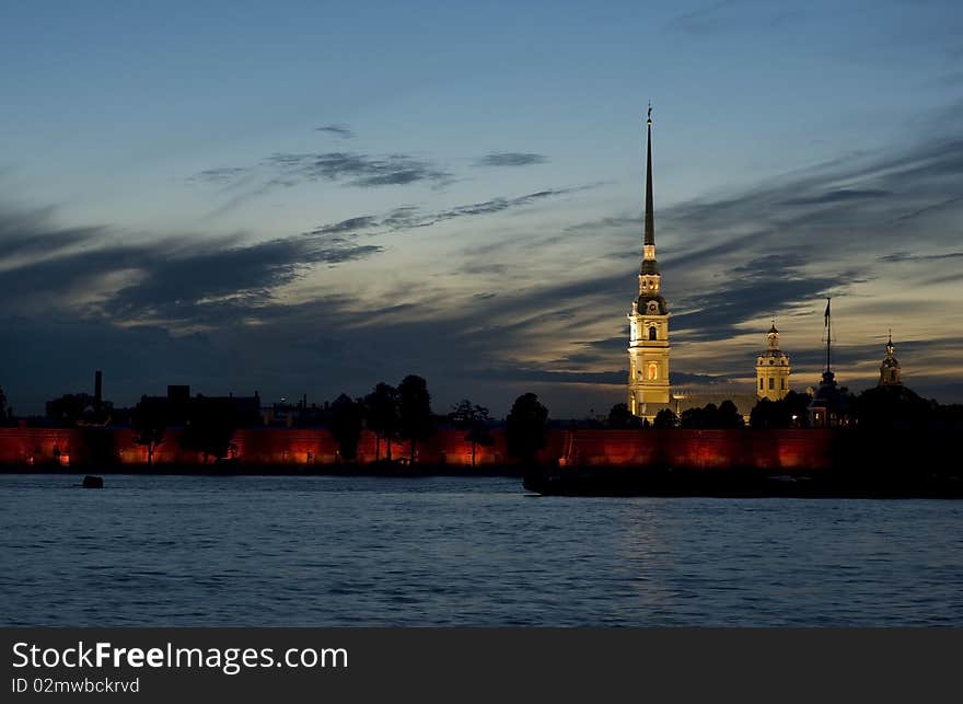 The silhouettes of Peter-and-Paul's Cathedral against the sunset and the Neva River. The silhouettes of Peter-and-Paul's Cathedral against the sunset and the Neva River.