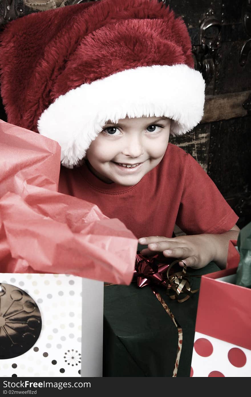 Excited boy waiting to open his Christmas presents. Excited boy waiting to open his Christmas presents