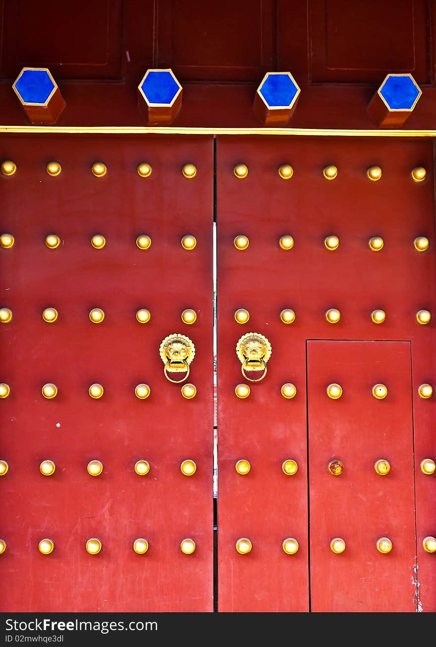 Red door in hutong area, close to Forbidden City, Beijing, China