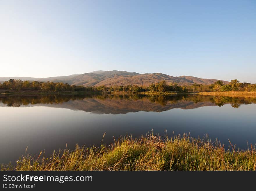 Mountain reflection in summer time