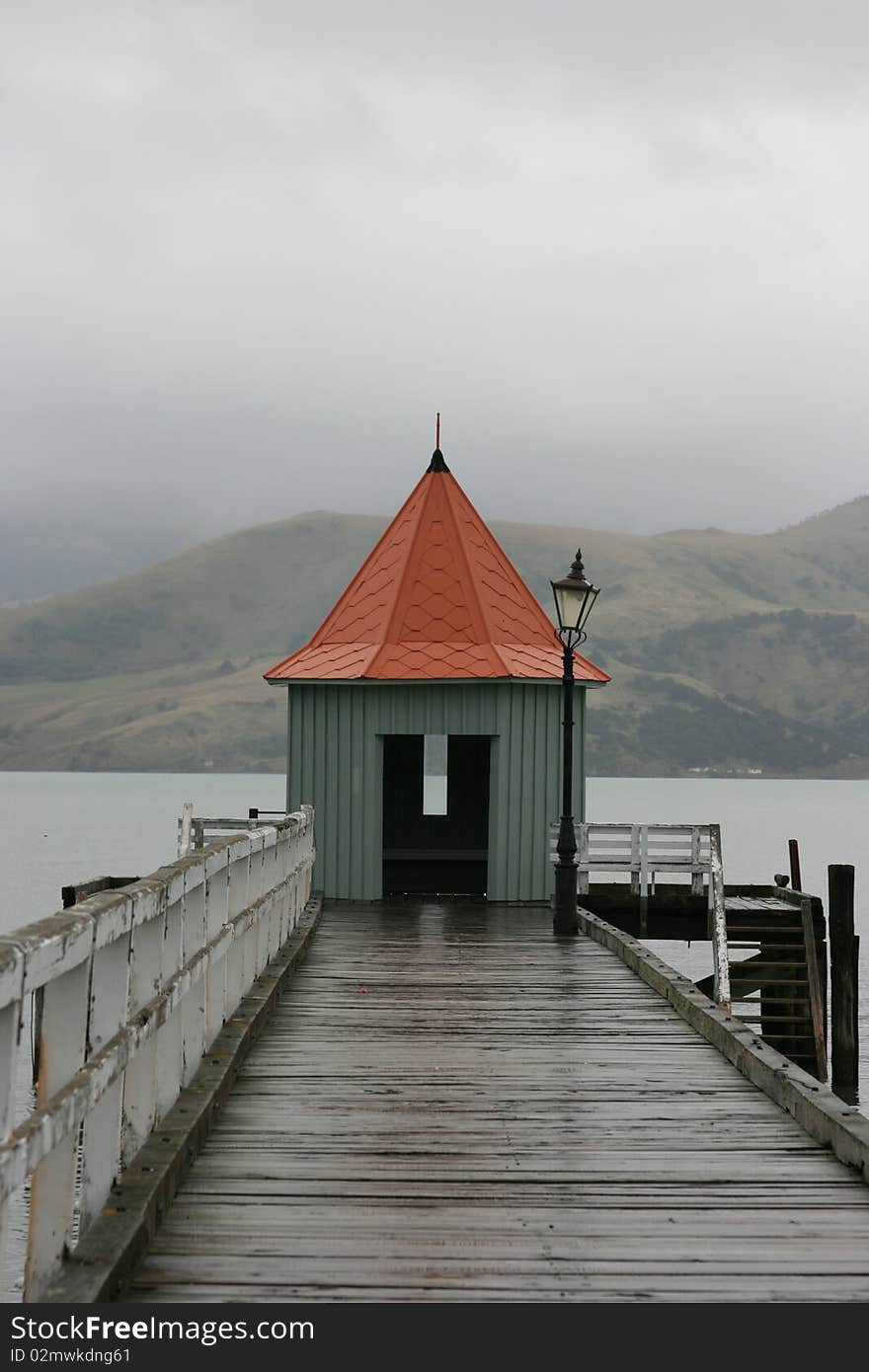 A rain swept wharf in the small town of Akaroa, New Zealand. A rain swept wharf in the small town of Akaroa, New Zealand.