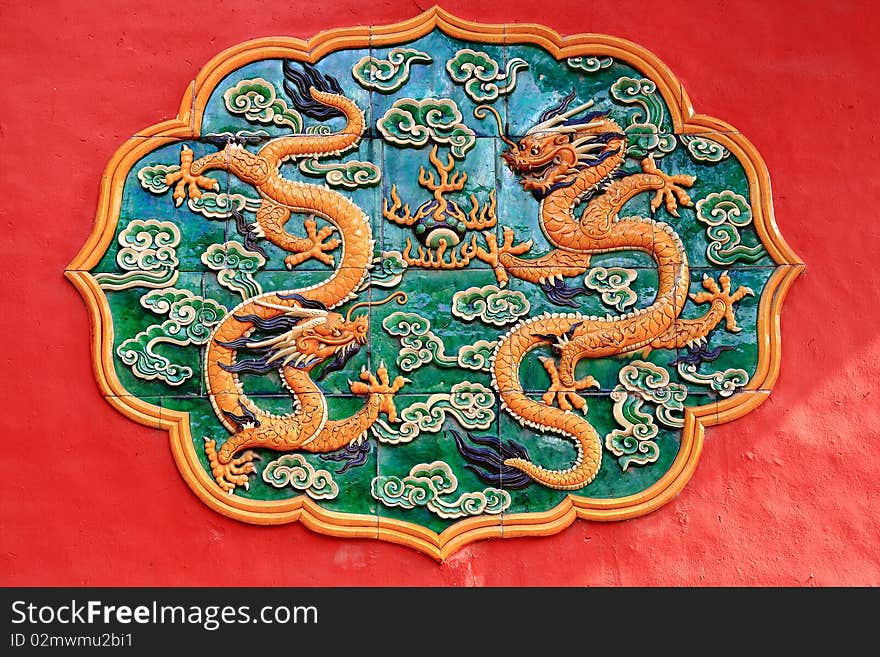 Yellow Dragon Ceramic Relief in Forbidden City in Red Wall, Forbidden City Emperor's Palace Beijing, China