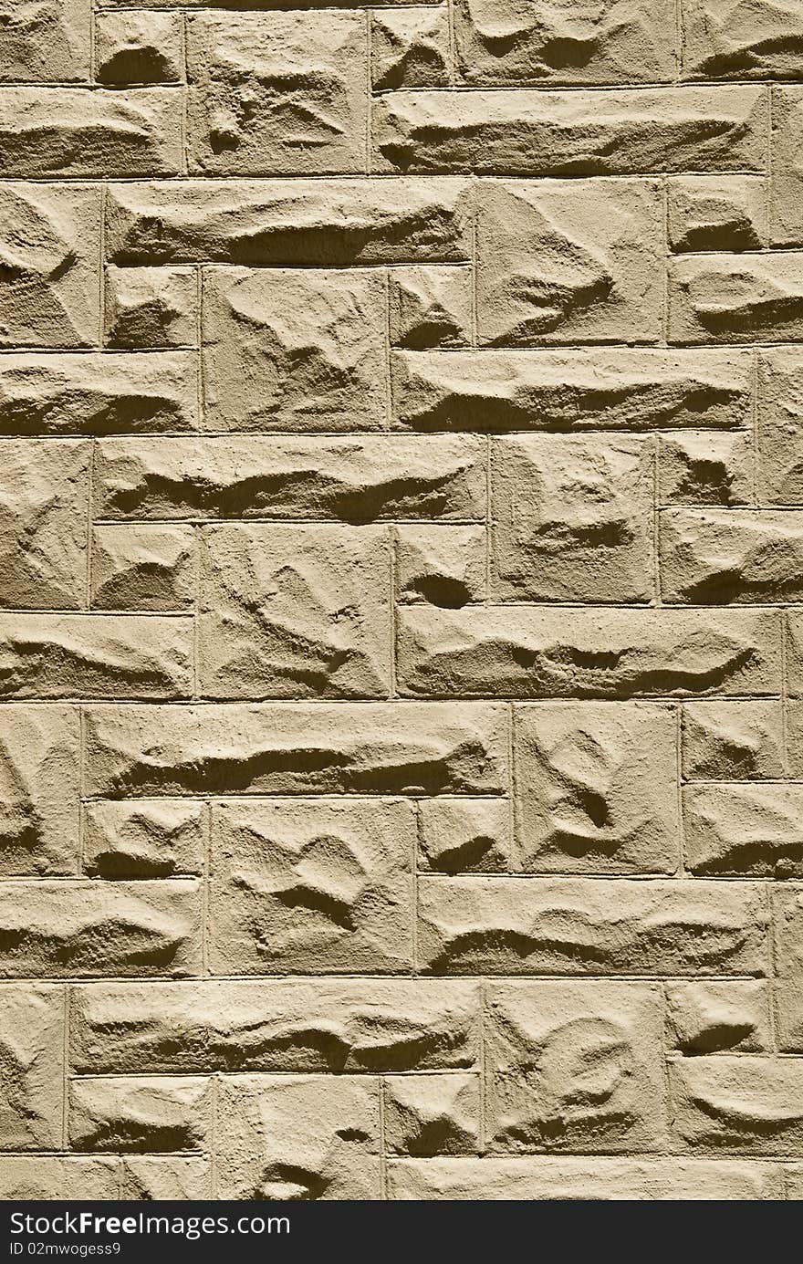 A look at a section of stone or brick laid church wall on a sunny day. A look at a section of stone or brick laid church wall on a sunny day.