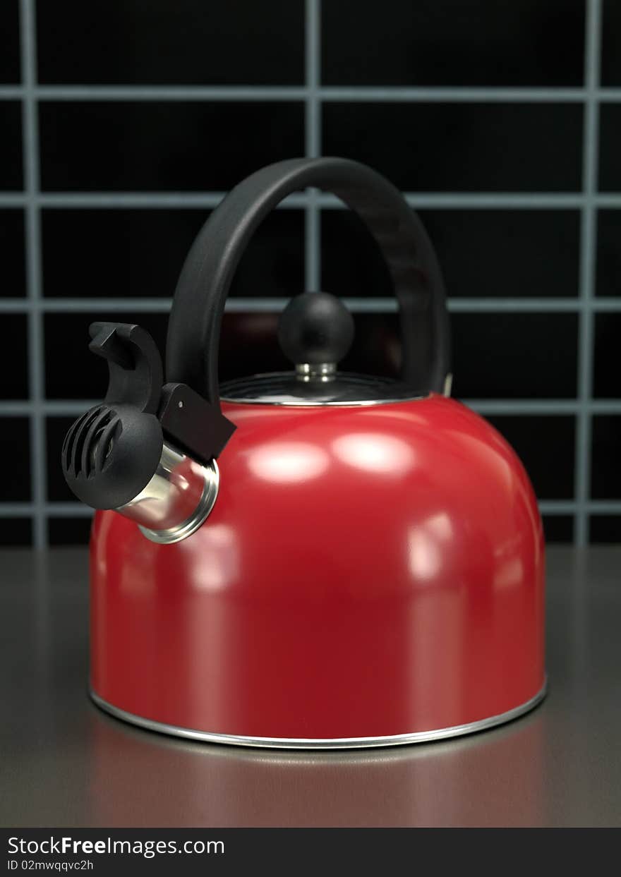 A stove top kettle on a kitchen bench