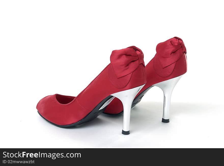 Red high heel shoe on white background. Red high heel shoe on white background