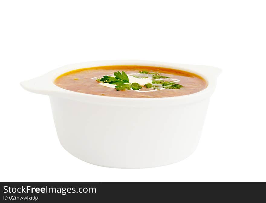 Plate with a borsch on a white background