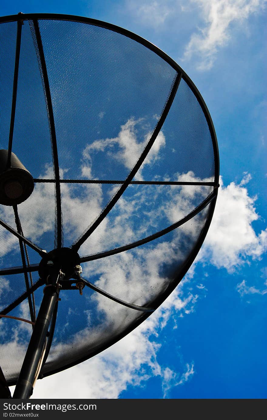 Satellite dishes on the house in the sun