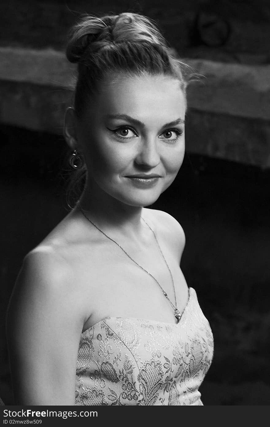 Young girl in evening dress somewhere in the slums. Photo in monochrome. Young girl in evening dress somewhere in the slums. Photo in monochrome