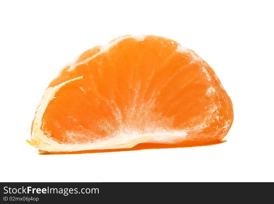 Segment of an orange orange (tangerine) removed close up. Segment of an orange orange (tangerine) removed close up