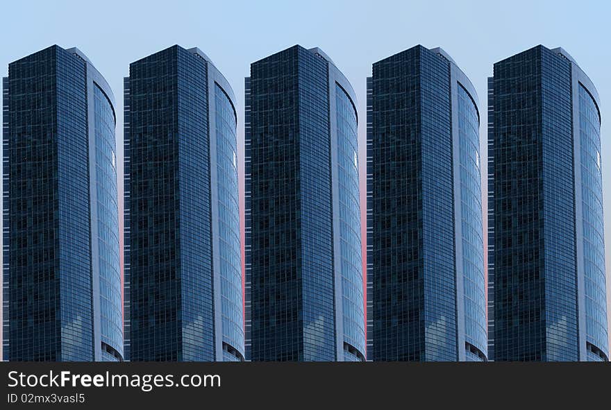 Several skyscrapers of glass and concrete against the blue sky. Several skyscrapers of glass and concrete against the blue sky