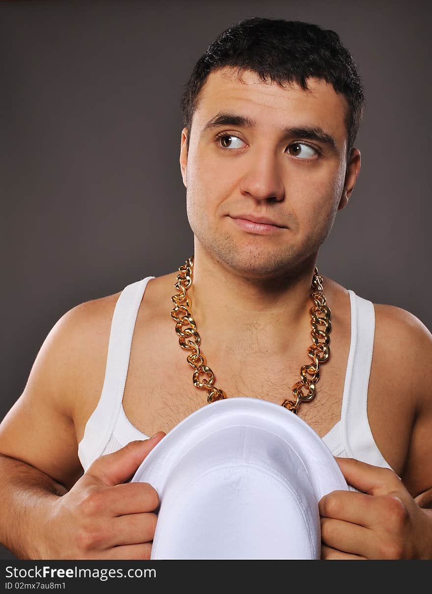 Stylish man holding white hat