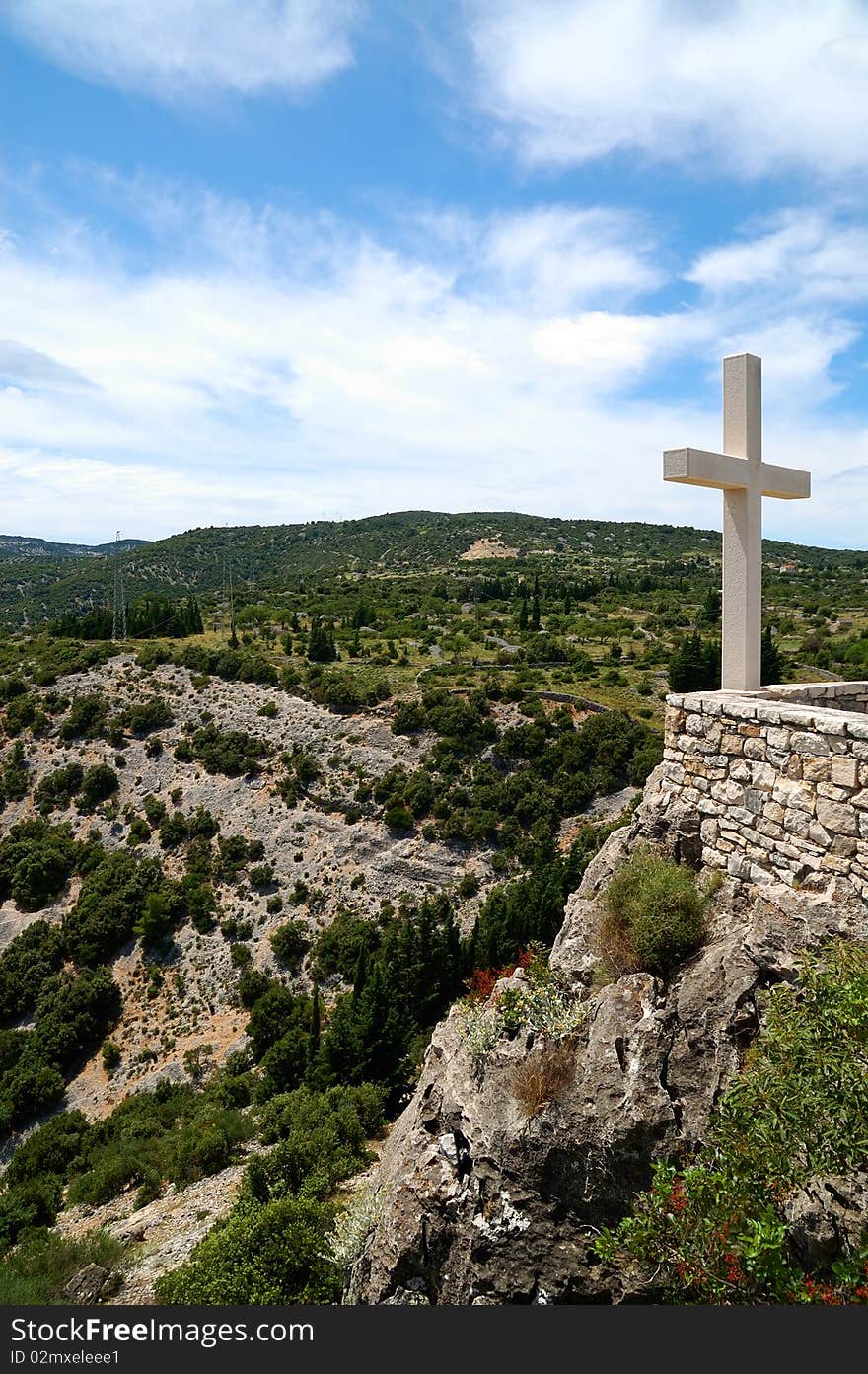 White cross on a mountain. White cross on a mountain.