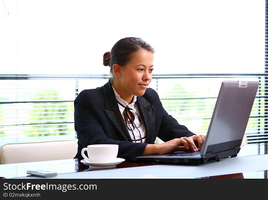 Happy business woman in the office