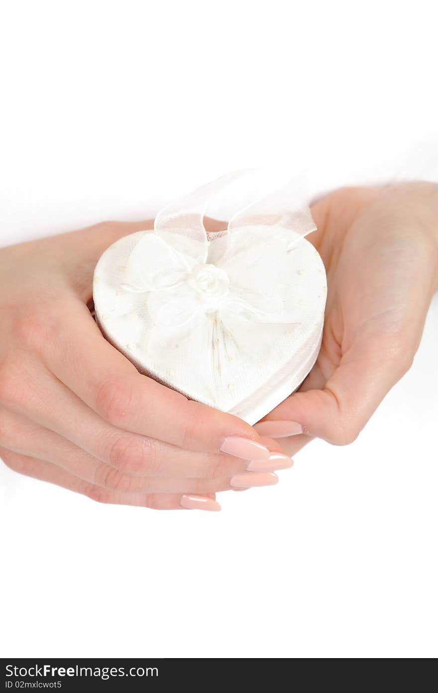 Beautiful woman hands with perfect manicure holding heart shaped engagement ring box. Beautiful woman hands with perfect manicure holding heart shaped engagement ring box